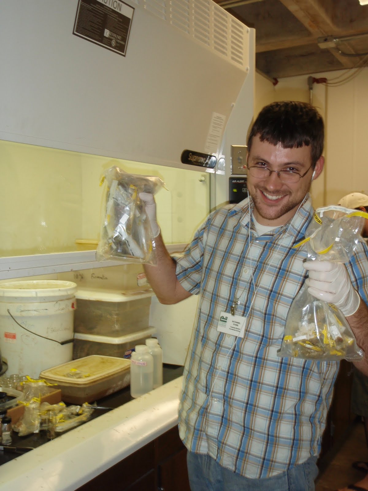 Nat posing with bags of specimens at the fume hood