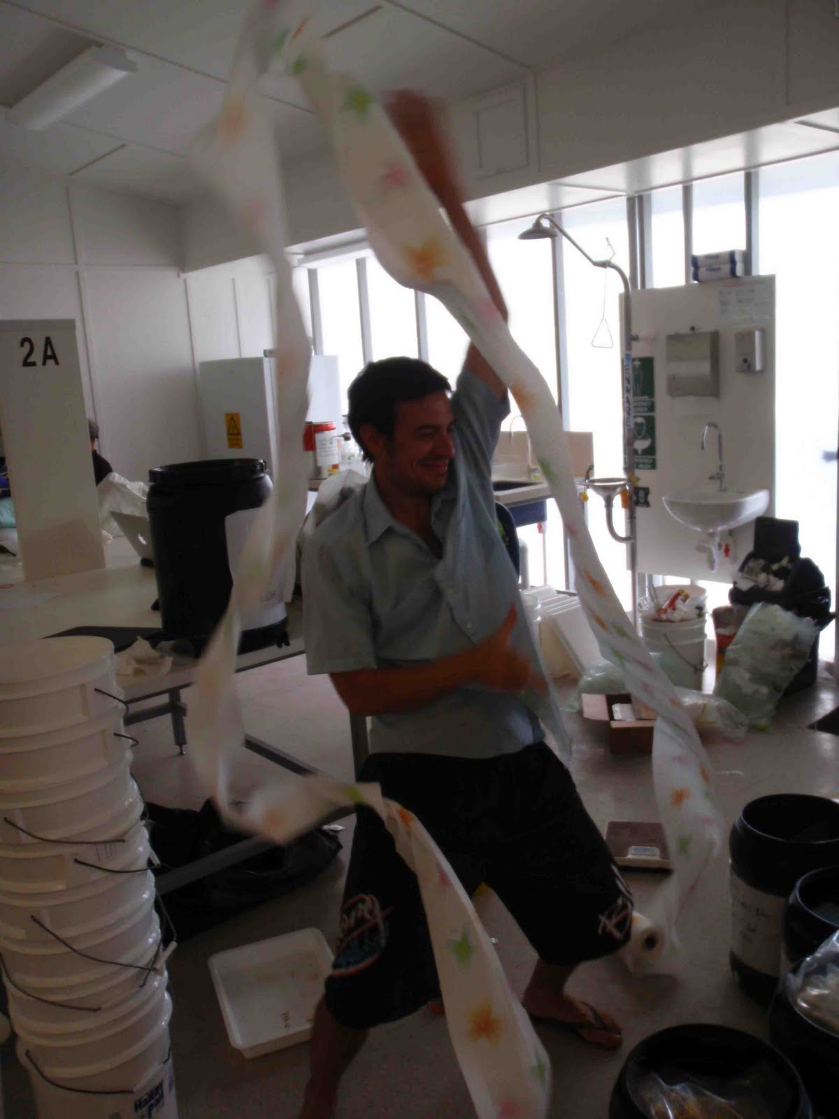 Rob flinging paper towel around the room