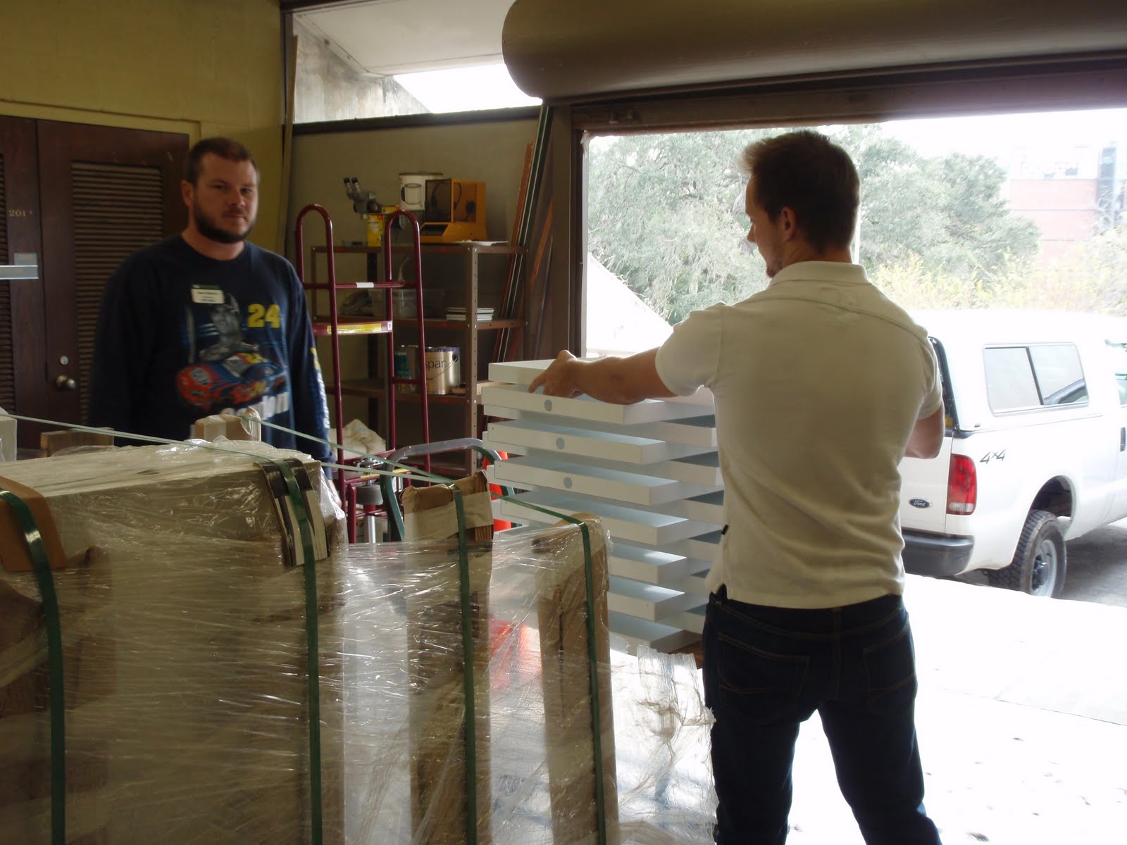 Derek stacking specimen trays onto a cart