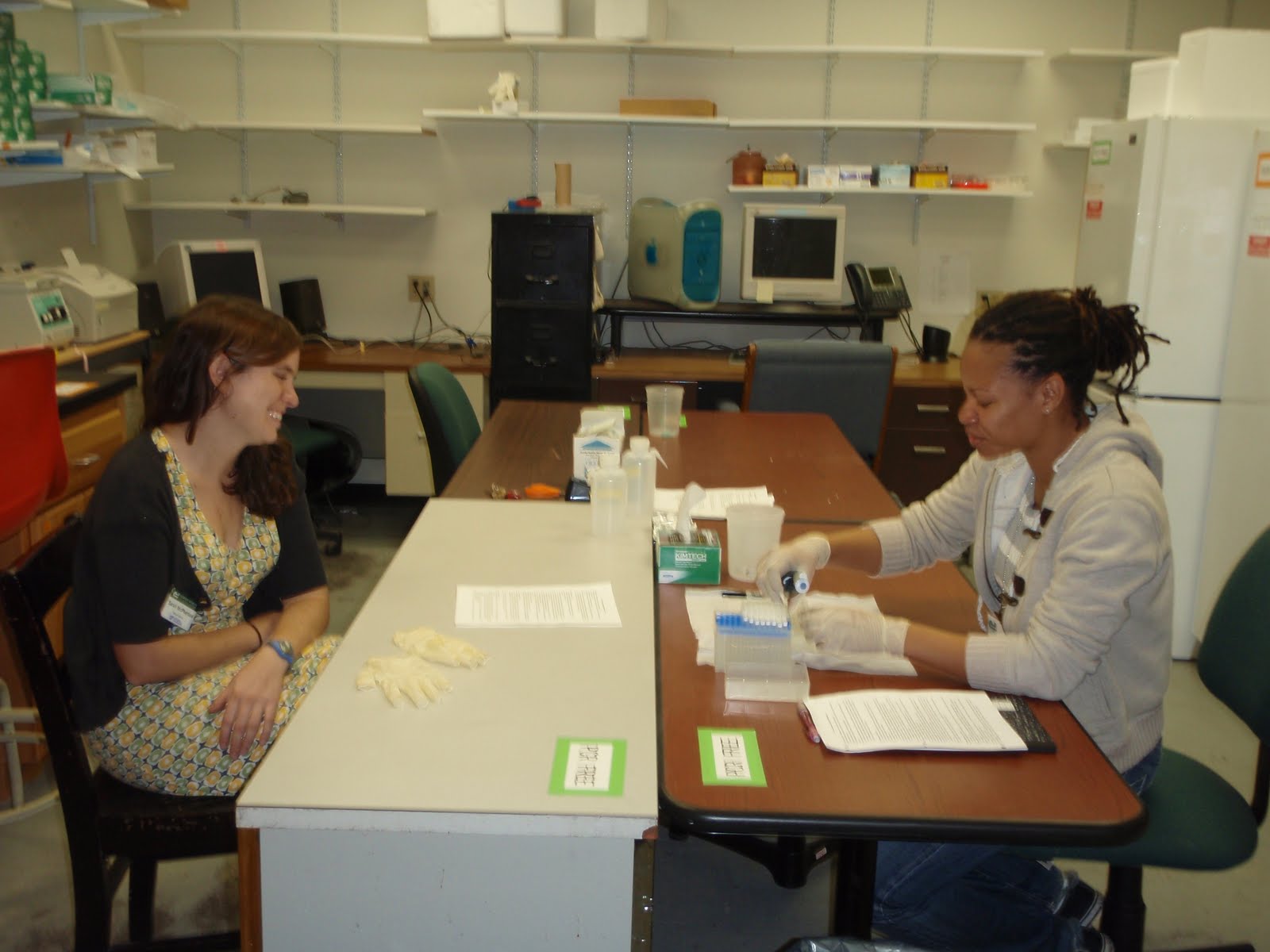 Sarah watching Jodi in the molecular lab