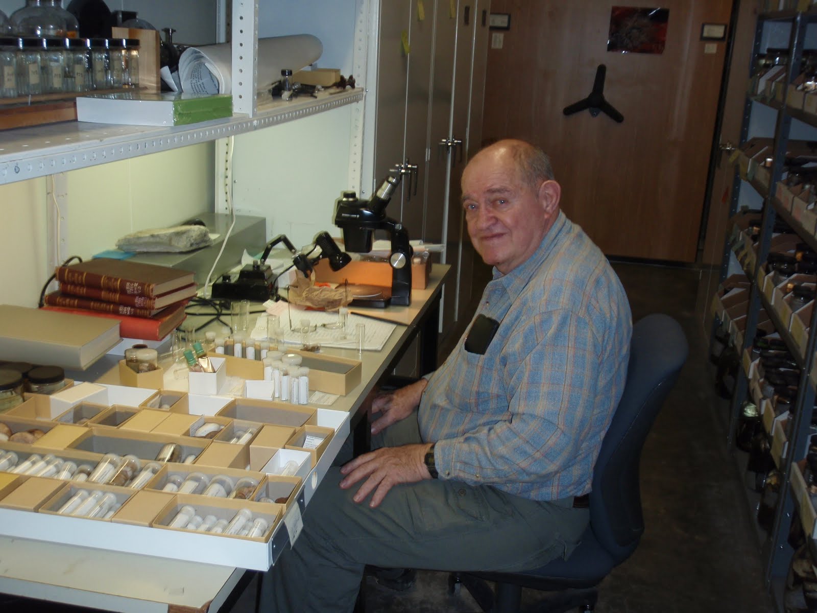 Fred at his workstation with trays of specimens