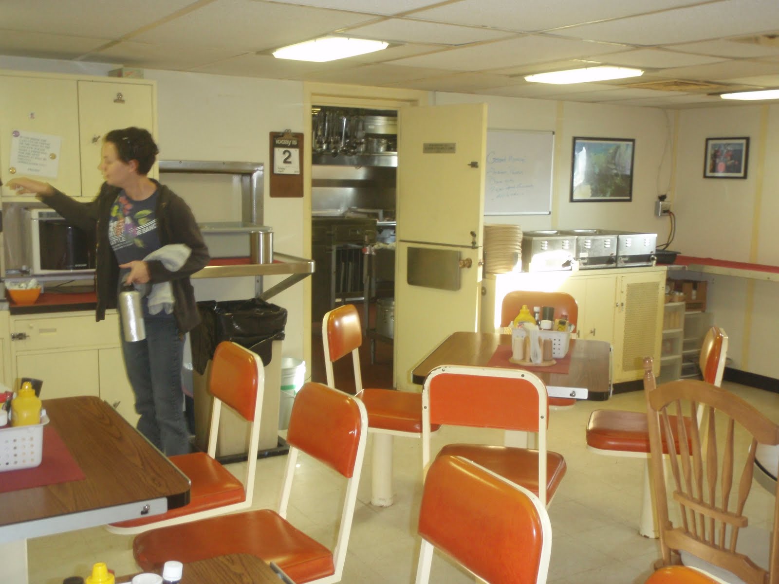 Jenna in the galley getting some coffee or tea