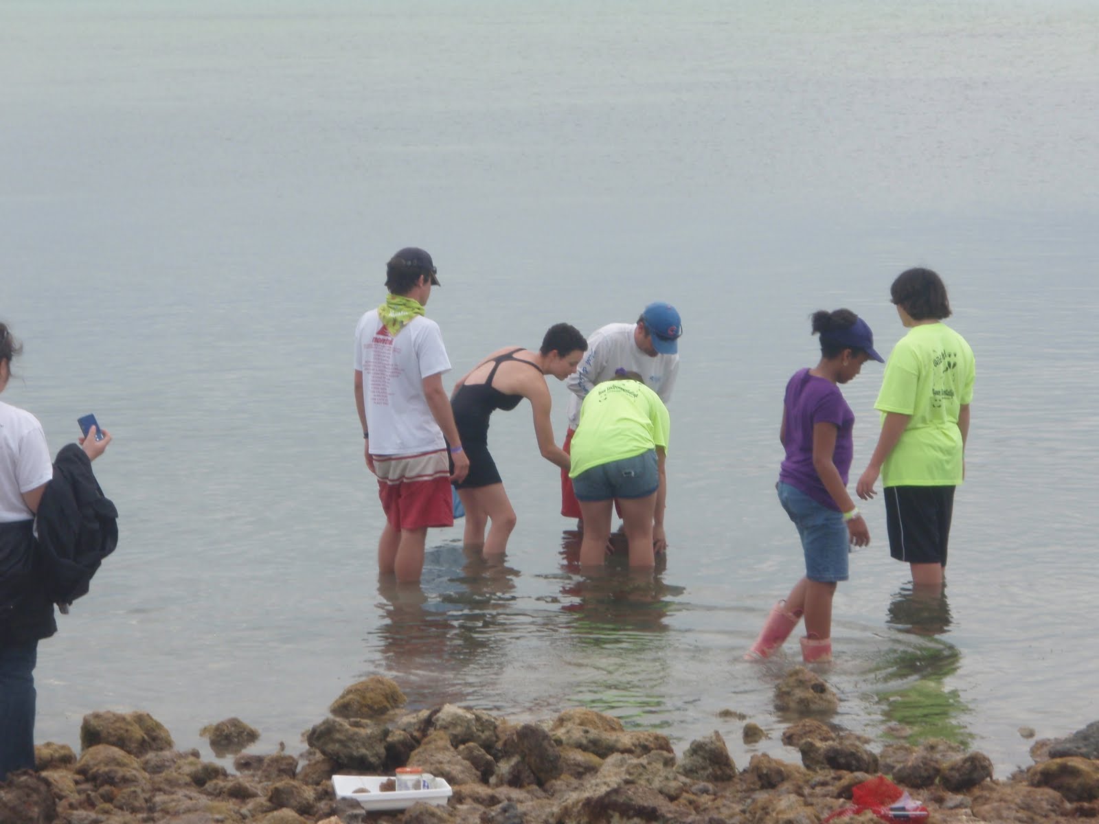 Jenna with group wading in water