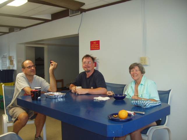 George, John, and Anne eatring brownies in the kitchen