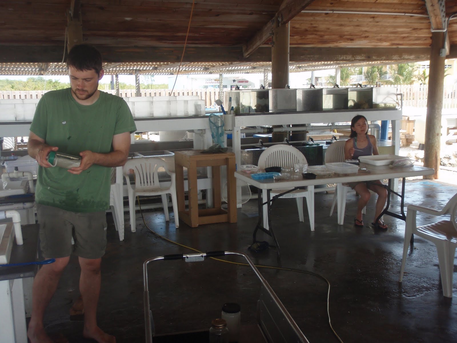 Nat and Hsiu in outdoor lab with water tables