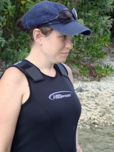 Sarah in hat and wetsuit, ready to work