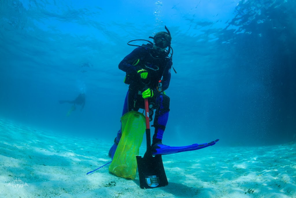 X marks the spot? FLMNH doctoral student Patrick Norby digging for 'burrowed' treasure.