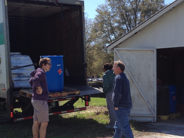 barrel of ethanol being unloaded from a truck