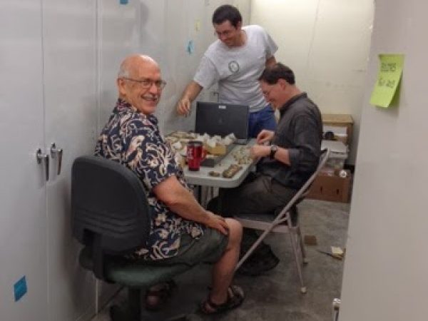 Jim Williams, Matthew Rowe, and Jordan Holcomb organizing shells