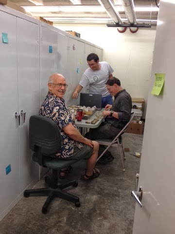 Jim Williams, Matthew Rowe, and Jordan Holcomb organizing shells