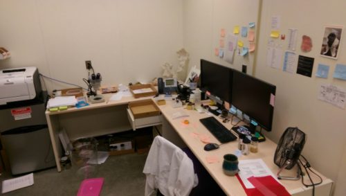 cluttered computer desk