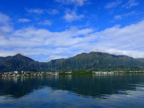 photo of Oahu from the water. big, blue sky