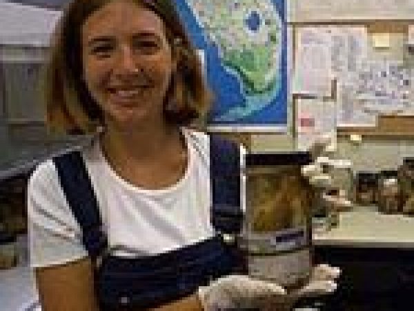 woman holding jar in front of florida map