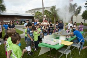 Florida Museum of Natural History visitors observe a simulated volcanic eruption. Florida Museum of Natural History photo by Kristen Grace