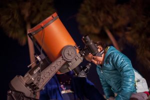 A visitor observes the night sky using a professional-quality telescope during the 2014 "Starry Night" event. Florida Museum of Natural History photo by Kristen Grace