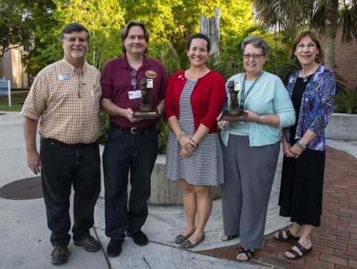 Museum volunteers of the year, Paul Roth, second from left, and Jeanne Chamberlin, second from right, are pictured with their supervisors, Roger Portell, far left, and Becky Dunckel, far right, and volunteer coordinator Amy Hester, center. ©Florida Museum photo by Jeff Gage