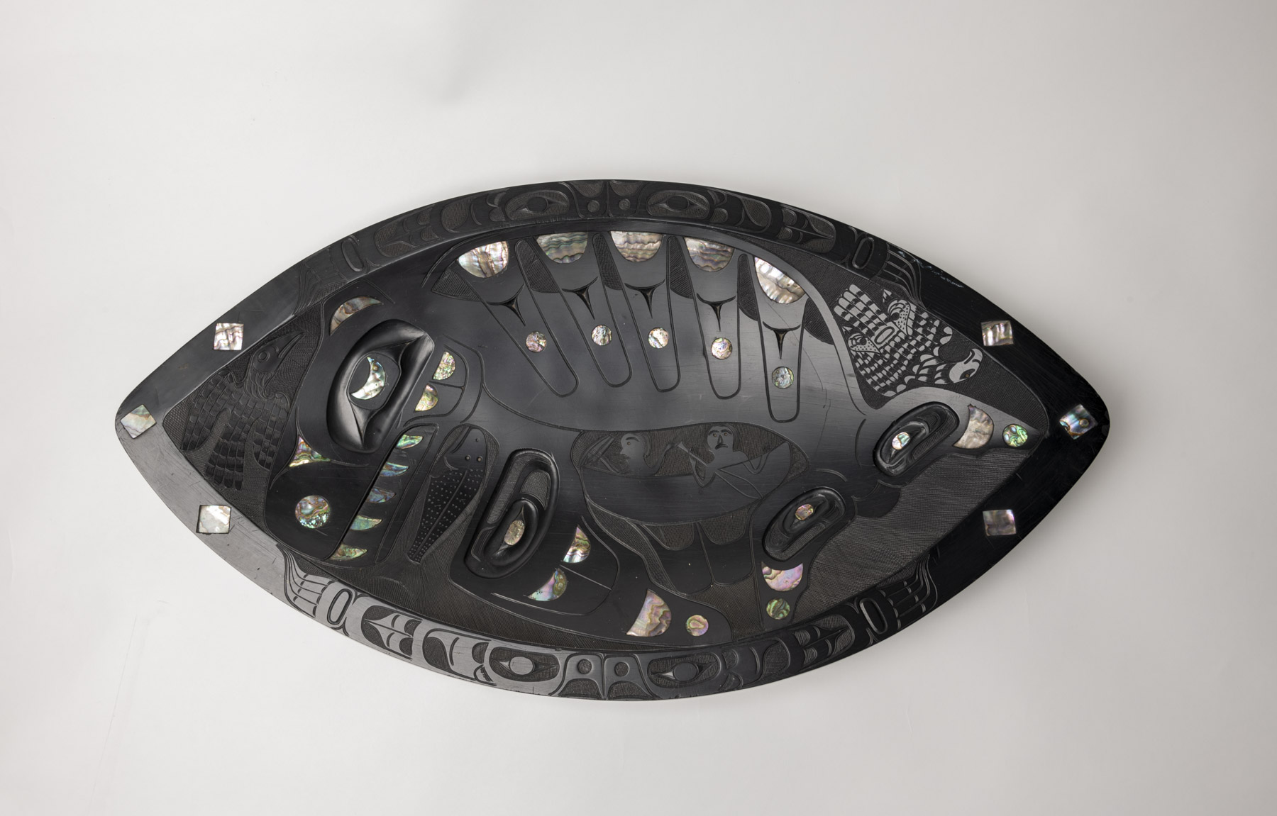 Decorated argillite platter with killer whale and two humans