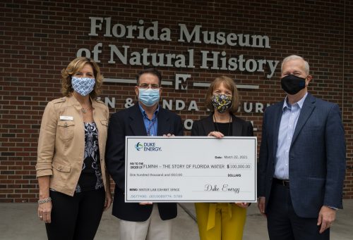 Duke Energy Representatives Give Check To Musuem