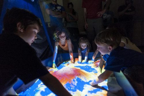 children interacting with AR sand