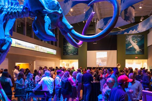 people dancing with blue lighting