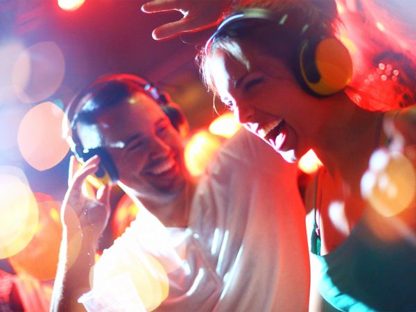 people dancing with headphones