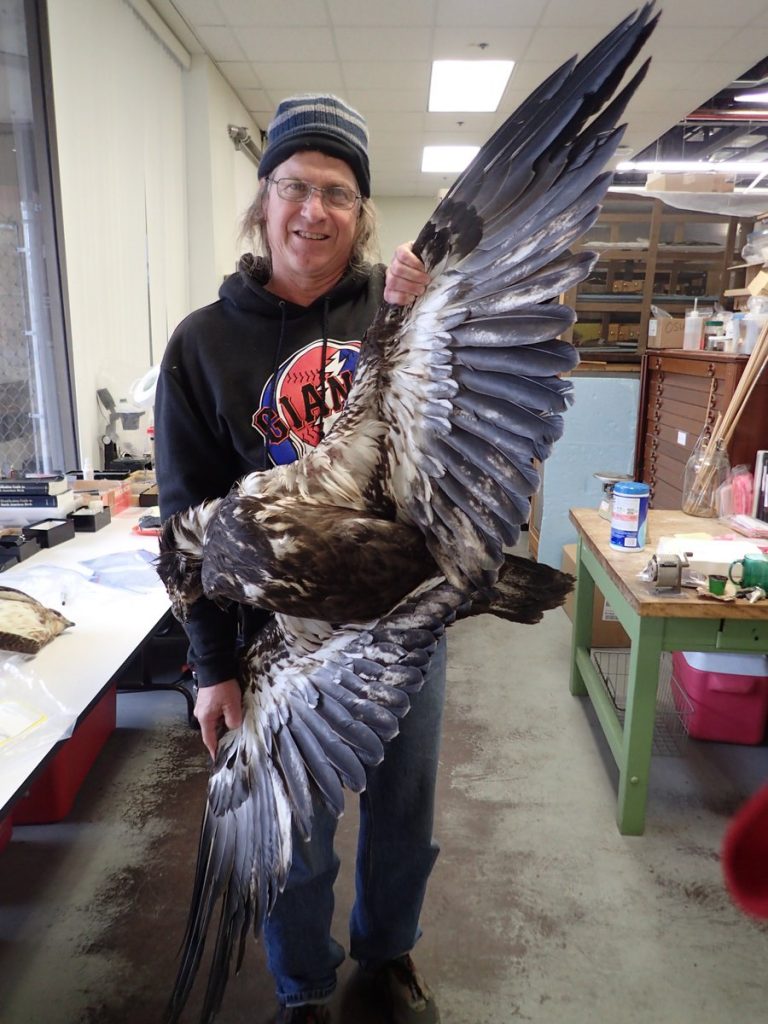 Andrew selfie holding large bird