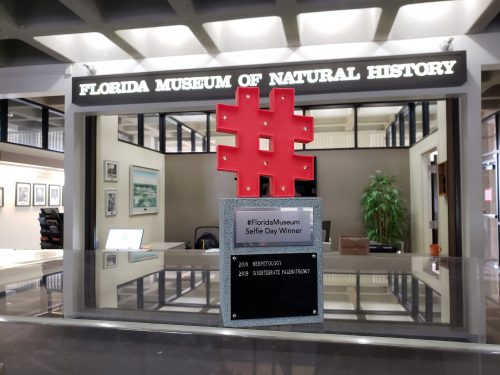 hashtag trophy on case in front fo museum sign