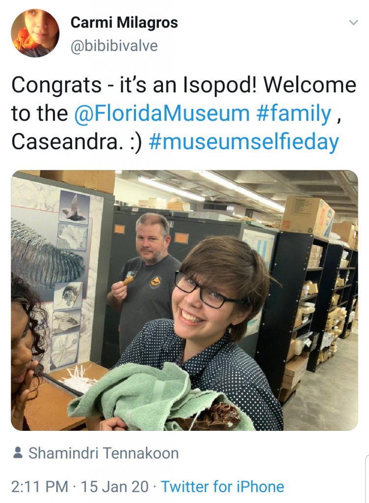woman taking selfie with fossil specimen
