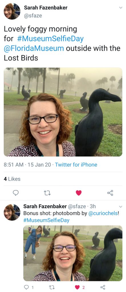 two selfies of women in front of large bird sculpture
