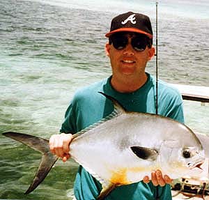 A happy permit angler! This fish was released to fight another day. Image © Sean Morey