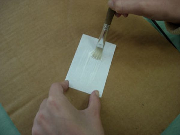 applying glue to label