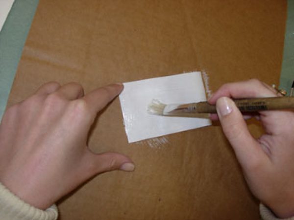 applying glue to label