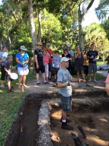 museum researcher talking to crowd