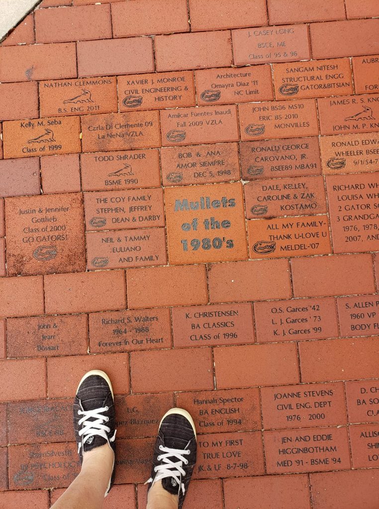 commemorative bricks with one reading 'Mullets of the 1980s'