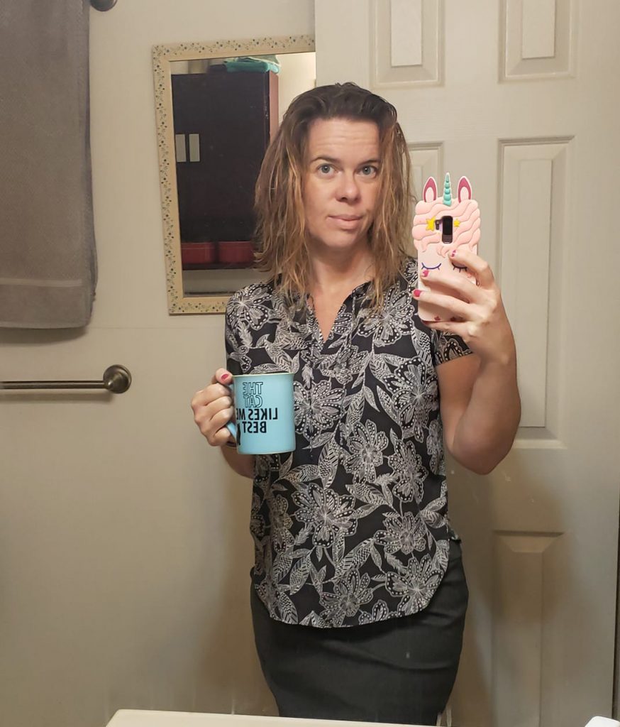 selfie in work attire holding coffee mug