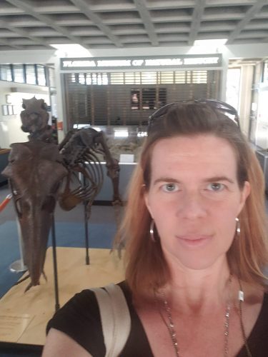 selfie in museum lobby with fossil sculpture