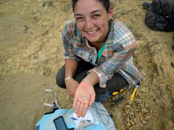 Honey, of the GABI RET program, displays a newly excavated shark tooth.