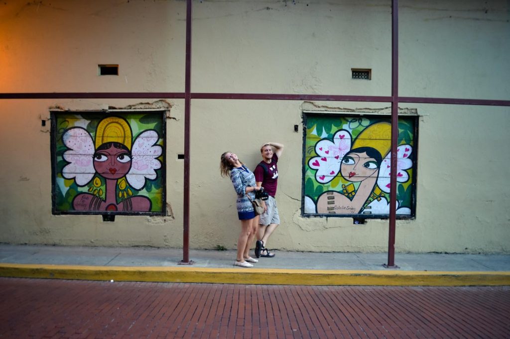Interns posing with street art.