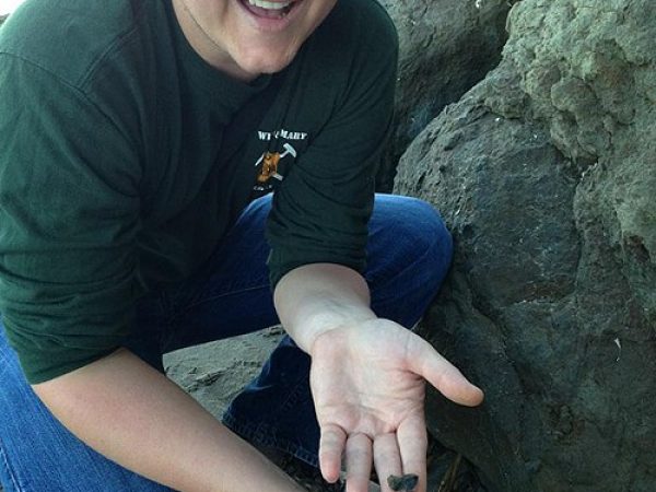 Sean Moran shows off a geological sample taken at Capitola Beach. Photo by Rob Hoffman.