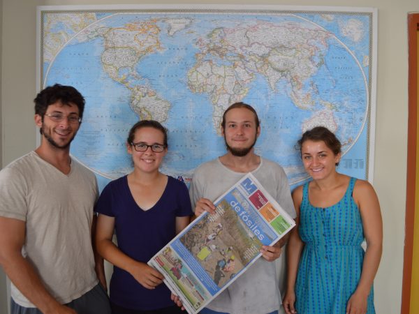 Spring interns in front of map
