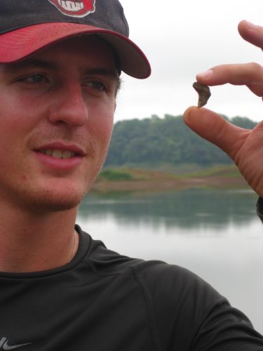 PCP-PIRE Intern Michael Ziegler proudly displays a well-preserved shark tooth of the Alajuela Formation. 