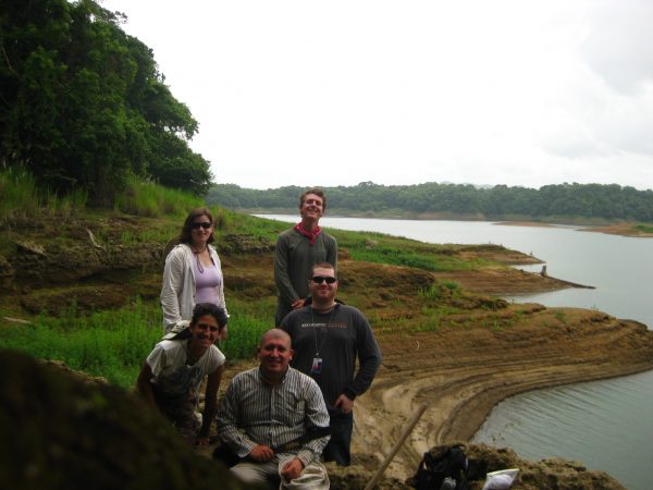 Invertebrate Paleo. collection team, July 15, 2015, Lago Alajuela. The terraced shorelines and extremely low lake levels reflect record lows in rainfall during June, the third driest June on record in Panama in the last 100 years. So much exposed shoreline makes for fantastic fossil hunting. Starting with the back row and moving left to right, Cristina Robins, project coordinator PCP-PIRE; Michael Ziegler, PCP-PIRE Intern; Ian Cannon, University of Florida; Jorge Moreno, PCP-PIRE Field Leader; Gina Roberti, PCP-PIRE Intern, Summer 2015.