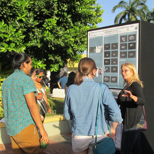 Paris Morgan presenting her poster to members of STRI at the Fellows and Intern Symposium. Photo courtesy of Paris Morgan.