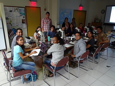 Students in the workshop identifying fossil woods. Photo courtesy of Dr. Peter Gasson.