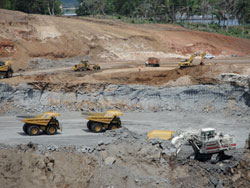 trucks hauling away dirt from canal