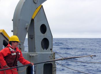 Amanda Waite, preparing to recover oceanographic instrumentation while on deck watch aboard the R/V Melville in the Pacific. © Photo by Gabi Weiss.