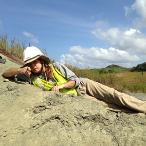 Adam Bouché brushing away sediment to search for fossils at the Panama Canal. Photo courtesy of S. Westacott.