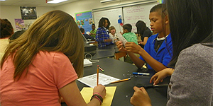 Sixth grade students at Westwood Middle School work together on an Earth Science lab. © Photo by Judit Ungvari-Martin
