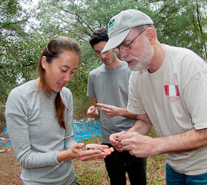 Dr. Bruce MacFadden identifying a fossil found by Laura Beach, Soquel High School Biology Teacher Santa Cruz, CA © Photo by Jeff Gage - Florida Museum of Natural History.