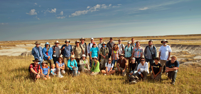 Group photo of the 2014 All Hands participants. Back row standing, from left: Bruce MacFadden, Carlos Jaramillo, Gary Bloom, Thure Cerling, Gary Morgan, Nathan Jud, Doug Jones, Cristina Robins, Jason Head, Evan Whiting, Jason Bourque, Claudia Grant, Sean Moran, Amanda Waite, Aaron Wood, April Carr, Jorge Moreno Bernal, Richard Hulbert. Kneeling: Doug Haessig, Fiona and Alma, Carmala Garzione, Kristen MacKenzie, Christina Byrd, Kathryn Rohlwing, Robyn Henderek, Rob Hoffman, Elena Stiles, Aldo Rincon, Michelle Barboza, Wesley von Dassow. Florida Museum Photo by Jeff Gage.